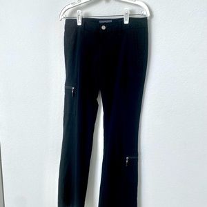 This cute black utility pants with plenty of pockets, 2 with zipper at front.